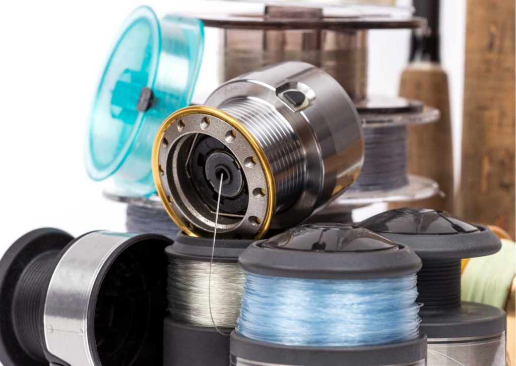 Stacks of Reels and line you might need for How you set up a basic fishing rod