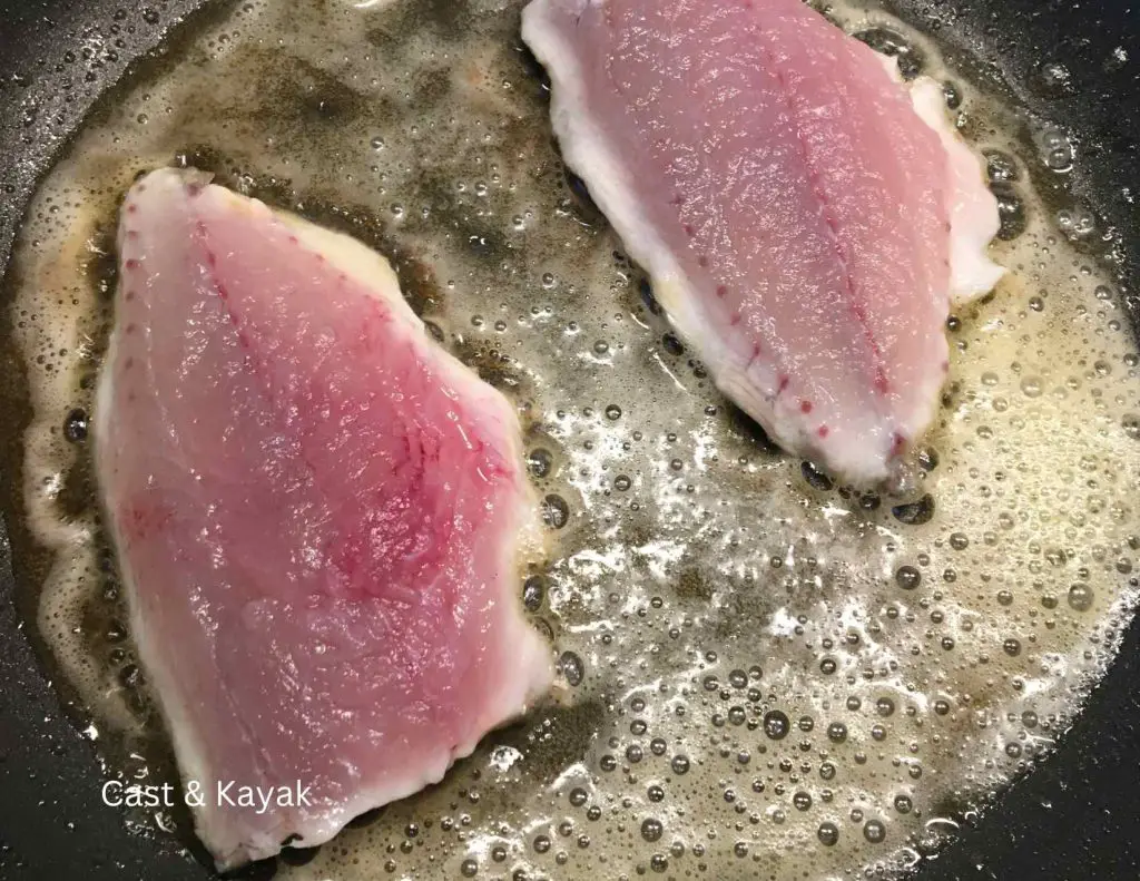 Frying fillets of bluefish