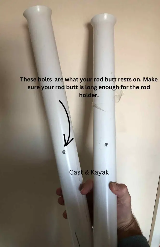 Holding two PVC spikes thinking how best to use a surf rod holder